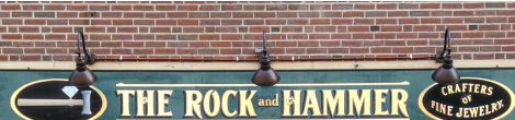 The Rock and Hammer storefront sign and logo